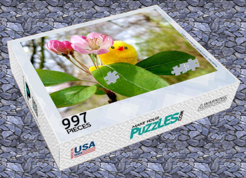 997-piece puzzle box with Marjorie poking her head out from behind a flower